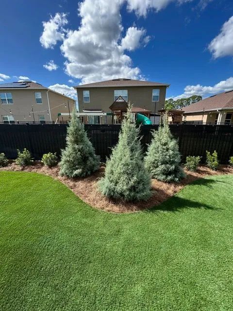Yard drain trench with catch basin grate in front lawn